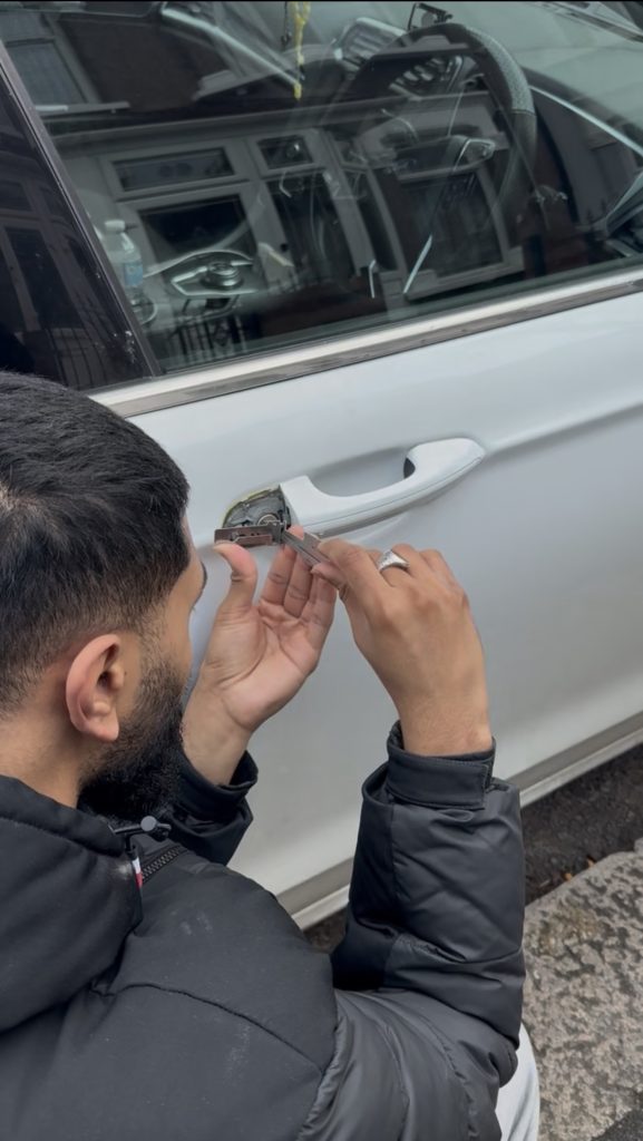 Auto locksmith unlocking a Ford vehicle in East London